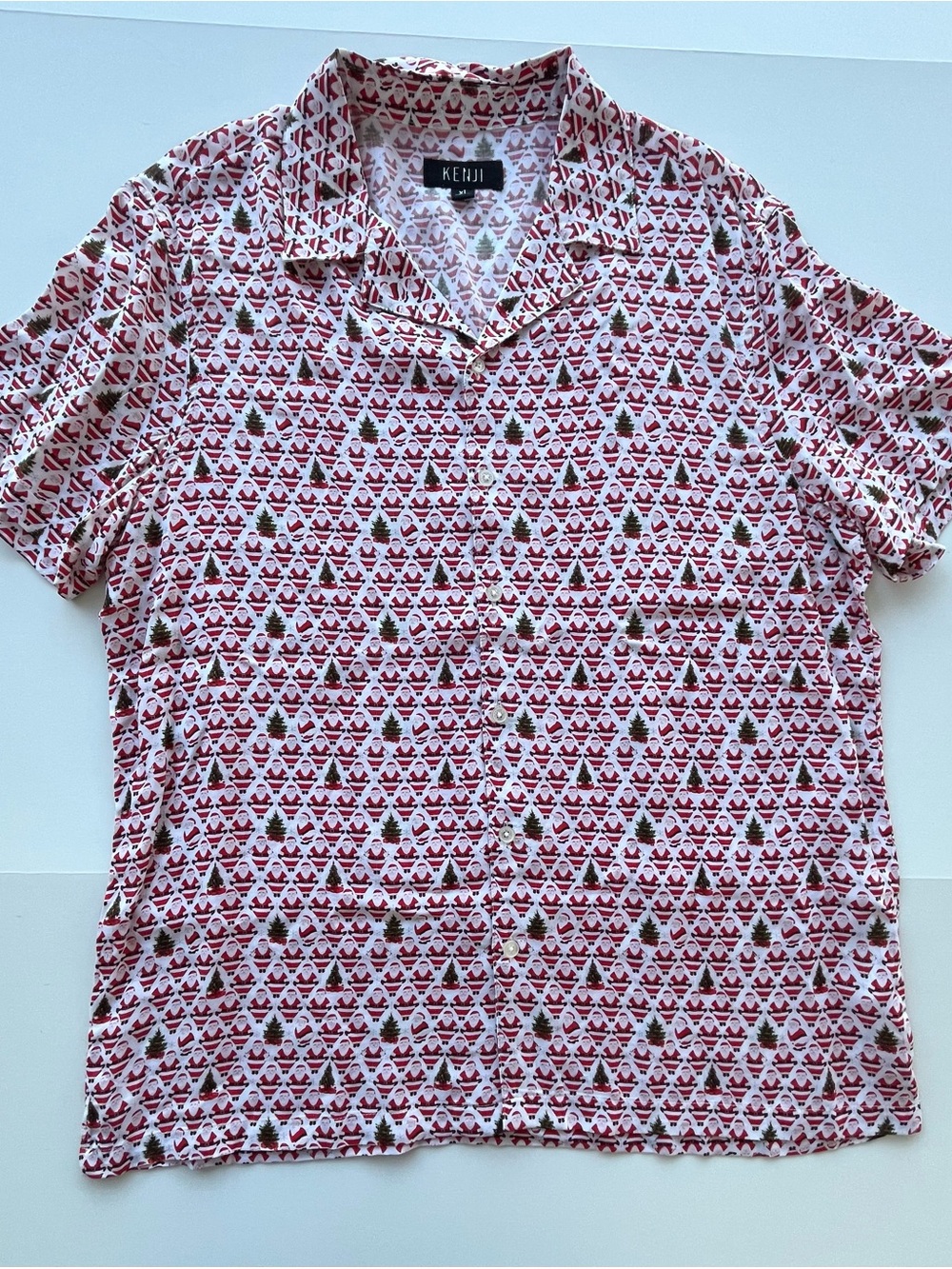 Naughty Santa moons and flips the bird. Fun party shirt! Men’s X-Large